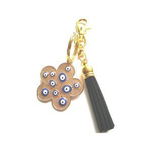 Gold tone blue evil eye flower charm key chain black leather tassel purse charm